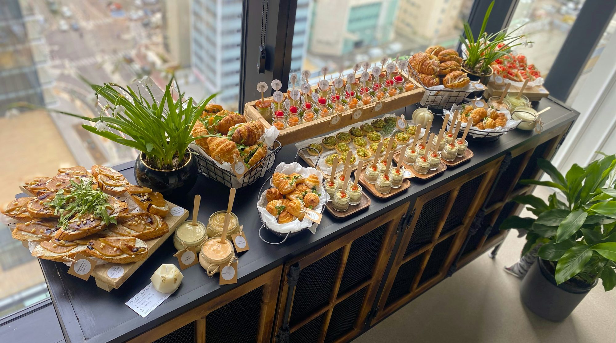 A Crew Table catering spread set up in a sunlit downtown office