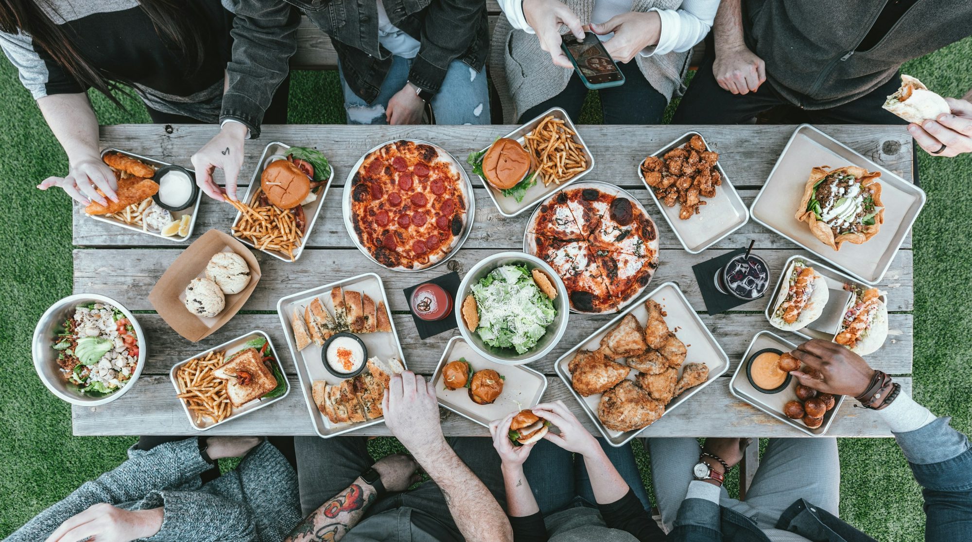A team sharing a catered spread around one table